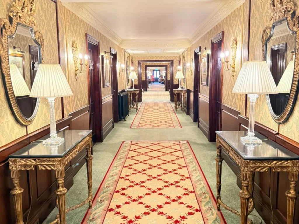 Kilworth House Hotel Corridor with Patterned Carpets, mirrors and lamps.